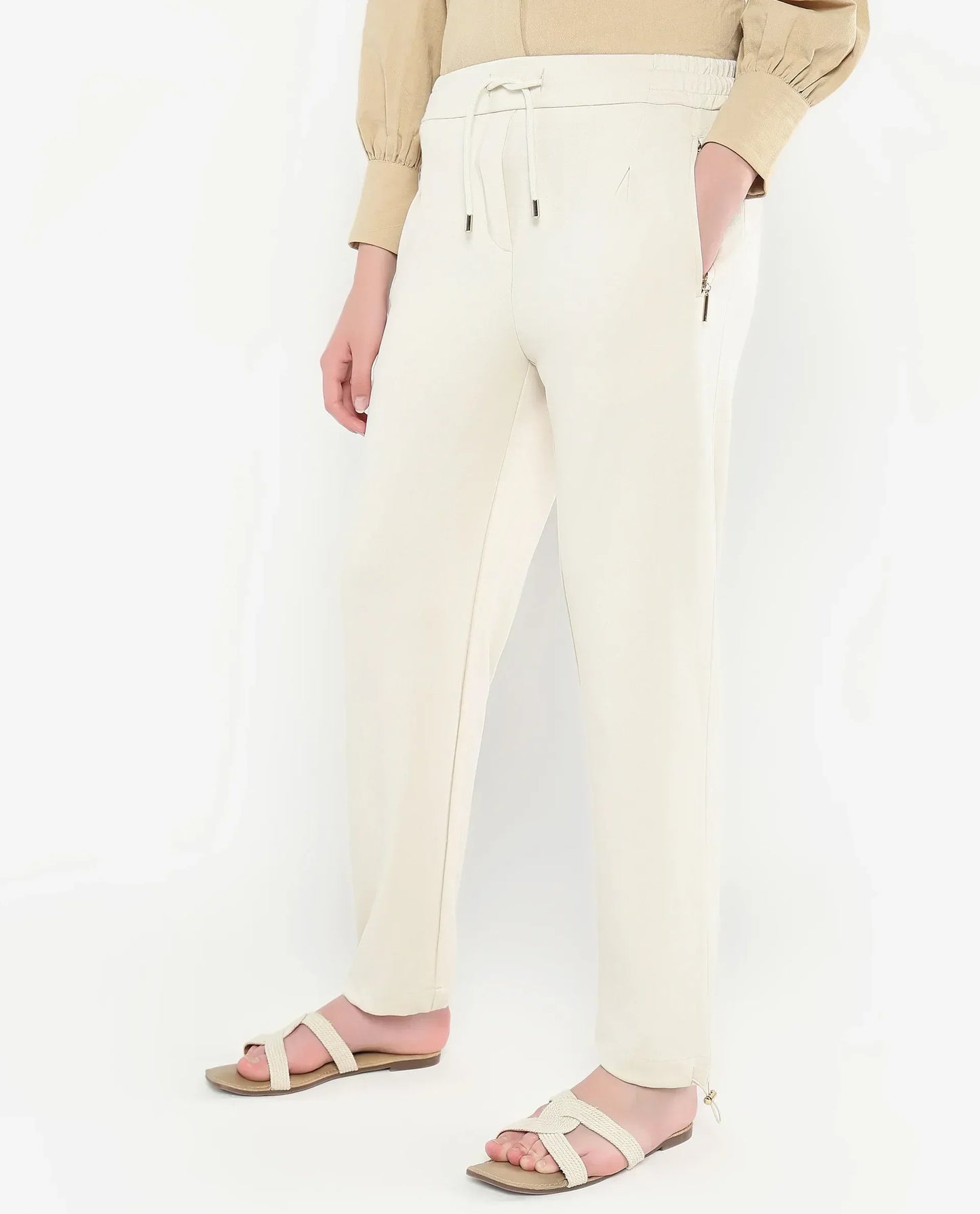 Rareism Women Gumushane Off White Modal Lycra Fabric Straight Fit Ankle Length Plain Track Pant