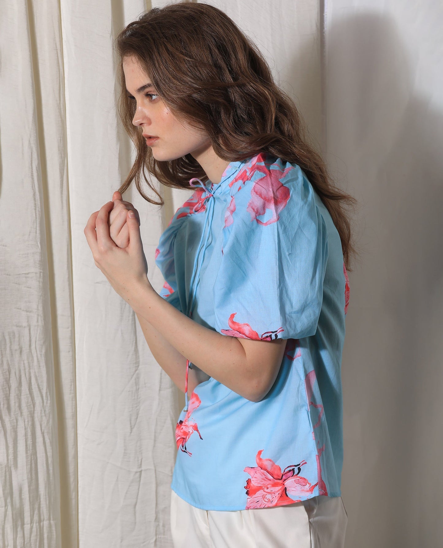 Rareism Women Kink Blue Cotton Fabric Short Sleeves Button Closure Tie-Up Neck Puff Sleeve Relaxed Fit Floral Print Top